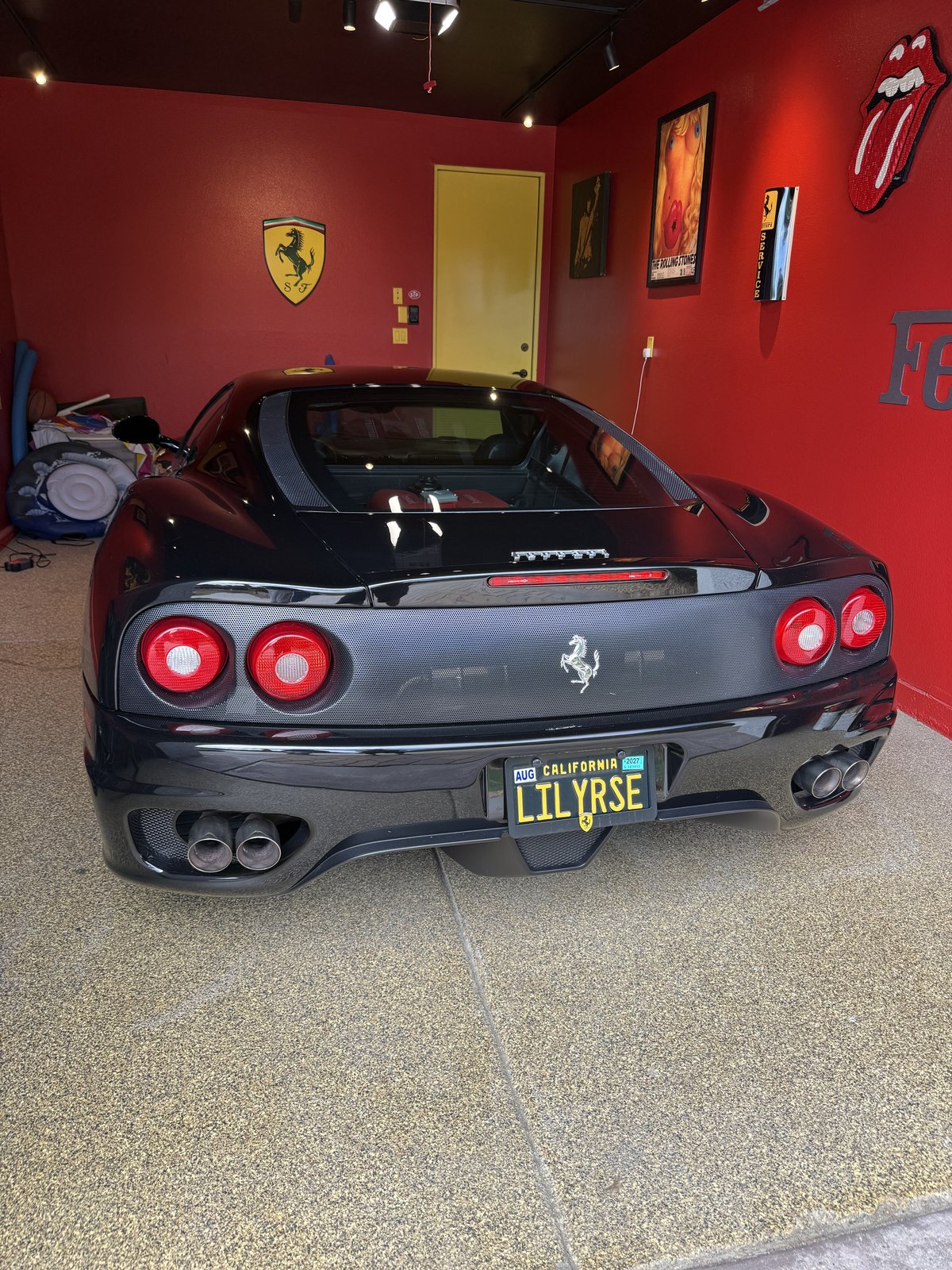 Black Ferrari with a California LILYRSE vanity plate